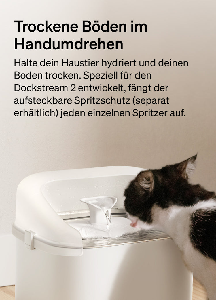 Petlibro PETLIBRO Brunnen: Katze trinkt am weißen Haustier-Wasserbrunnen neben Katzentoilette, Spritzschutz hält Boden trocken.